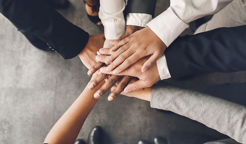 Hands coming together to promote new relationship