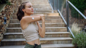 Young woman in athletic clothes stretching