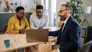 A financial professional explains the difference between joining or sponsoring a pooled employer plan to his clients.