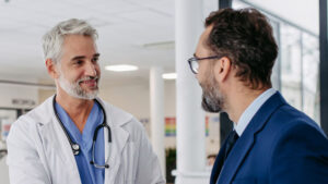 Physician and nurse meeting a prospective healthcare worker.