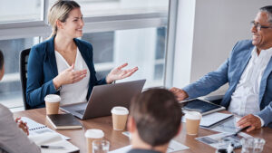 A financial professional meets with a leader at the financial services company she works with to discuss ideas for growth and improvement.