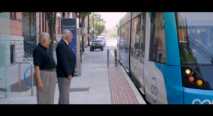 two men waiting for public transportation