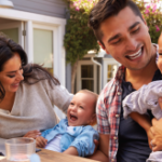 Family with young children laughing and enjoying each others company.